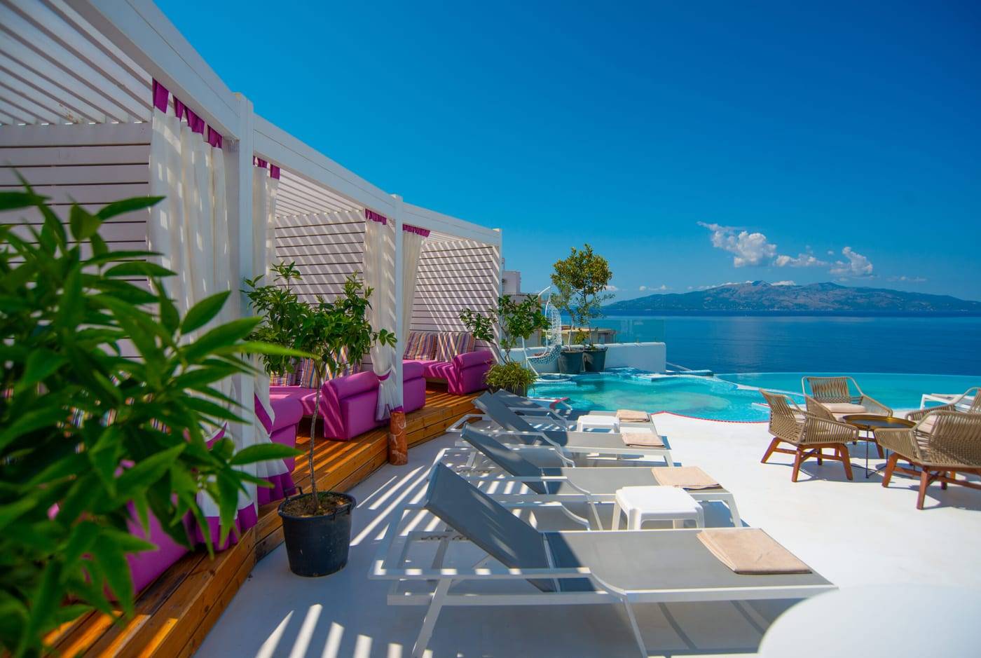 The rooftop terrace and pool at Bougainville Bay Resort & SPA on the coast road south of Saranda, with the sea and Corfu beyond